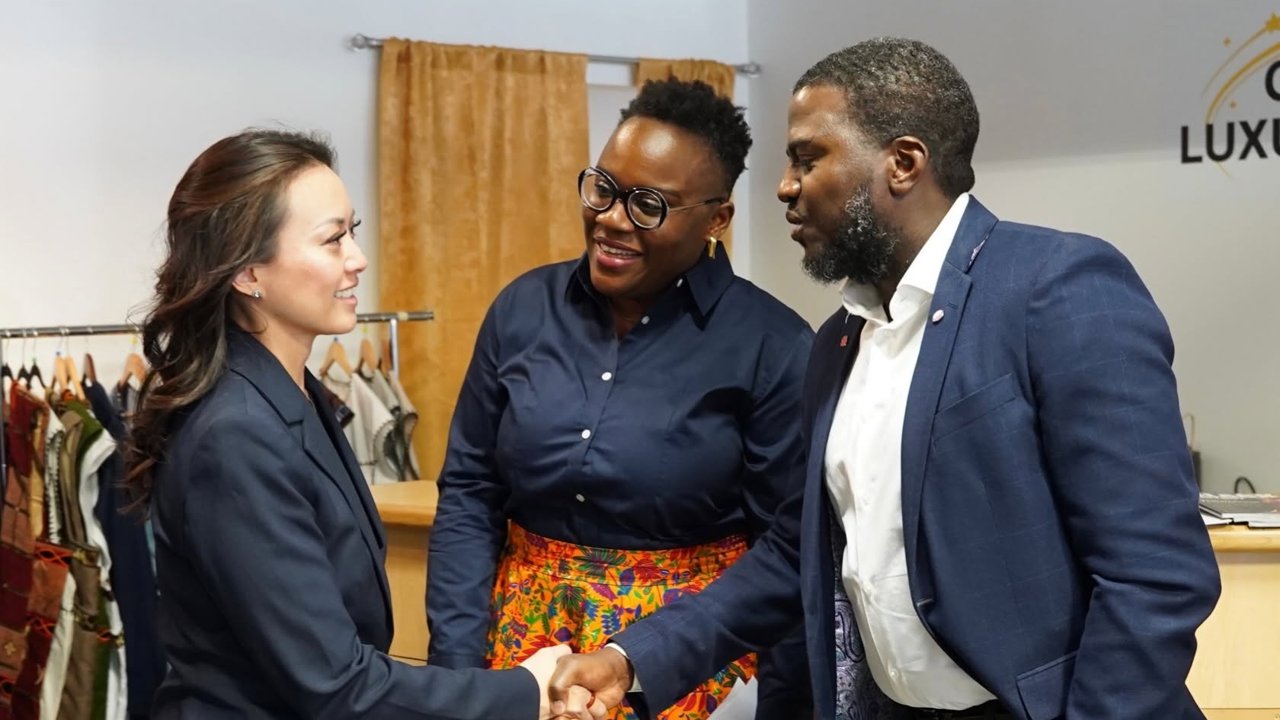 A welcome and handshake at the CoBSMEs and BPES event