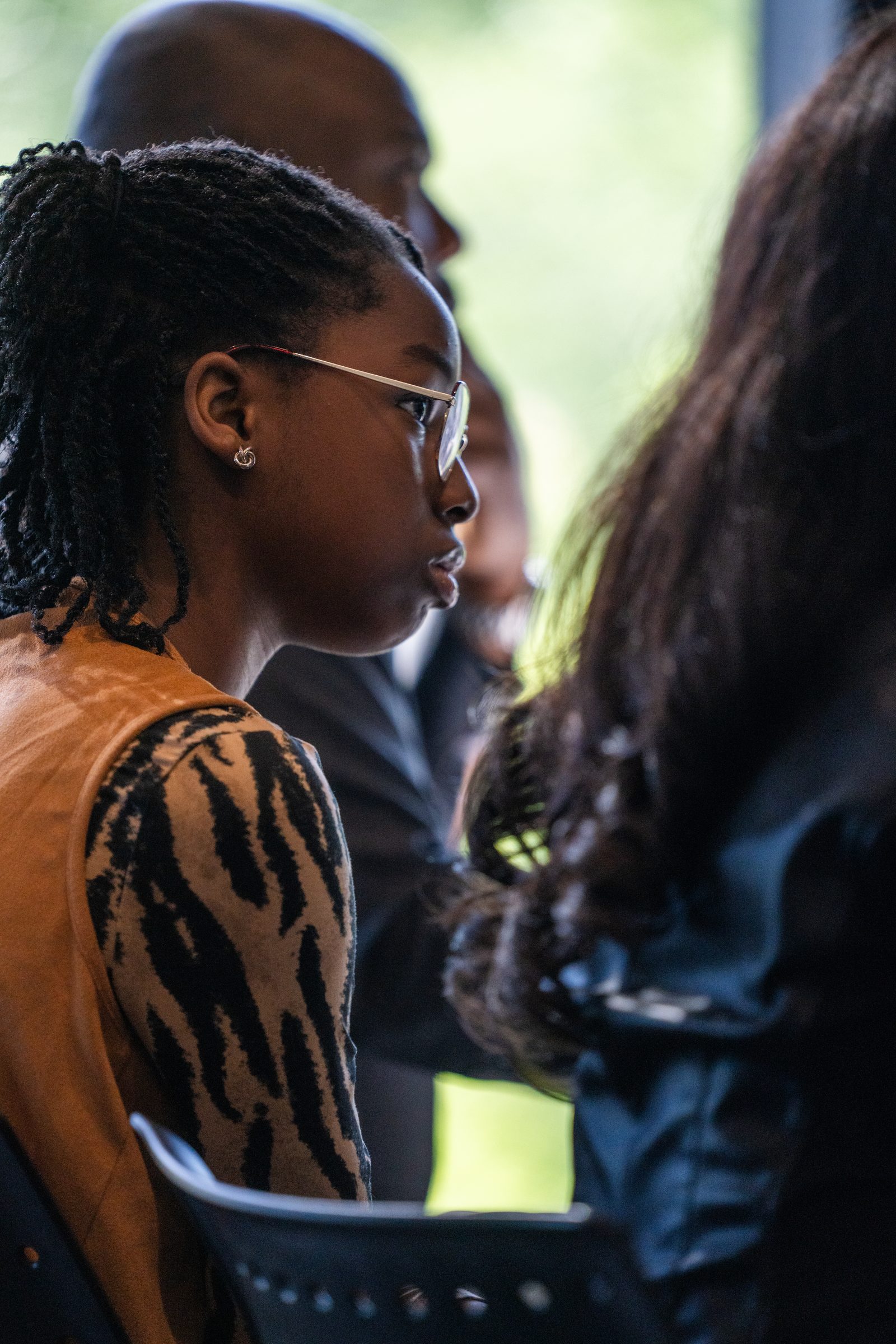 A participant listens closely during a conversation at the Saskatoon cohort