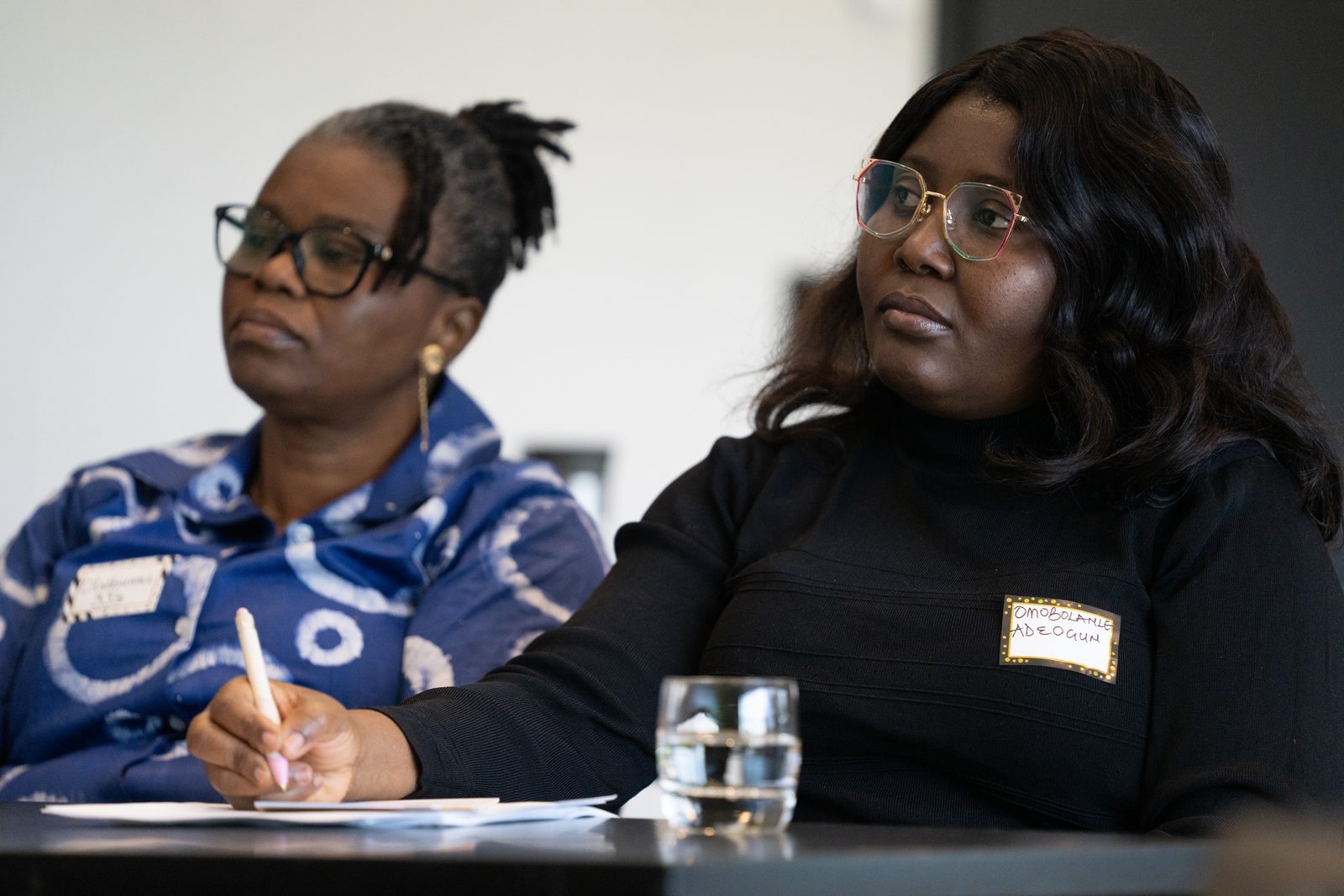 Two participants talk at their table during the Saskatoon session