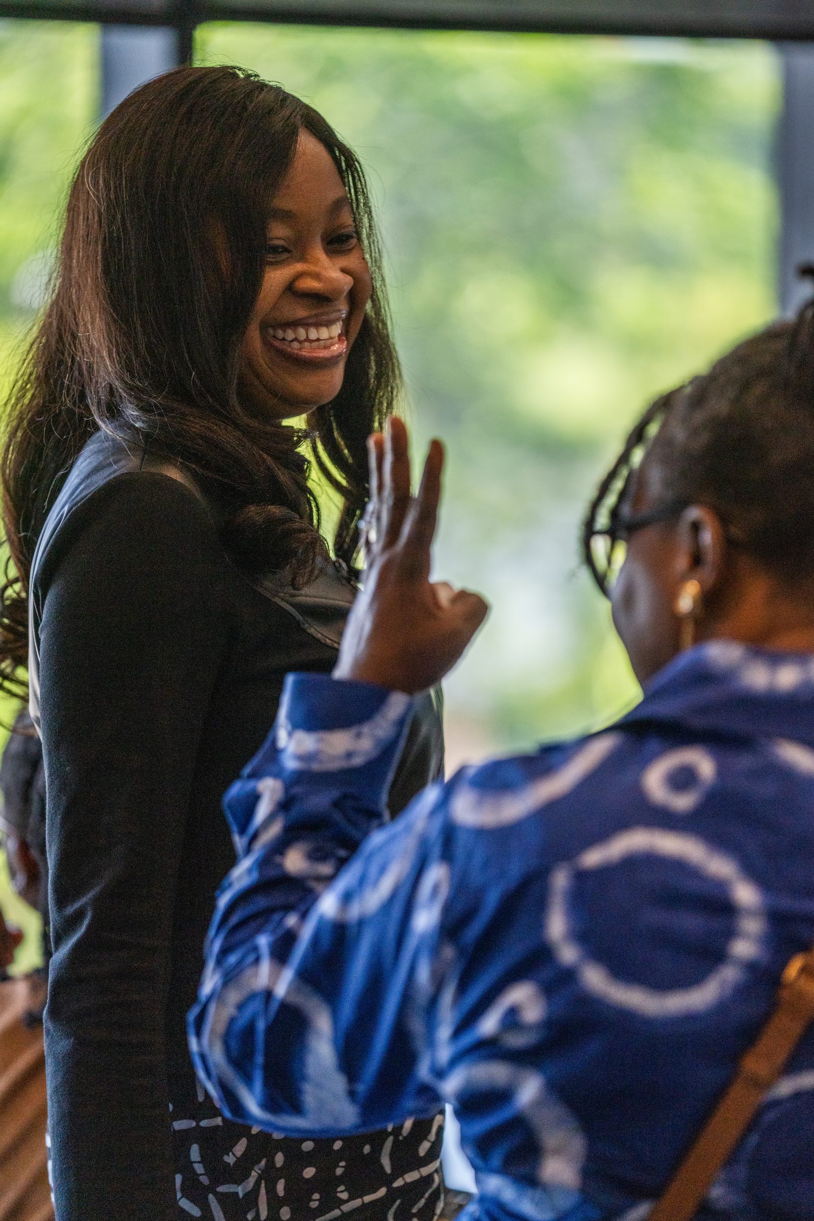 A participant shares a laugh while networking at the Saskatoon event